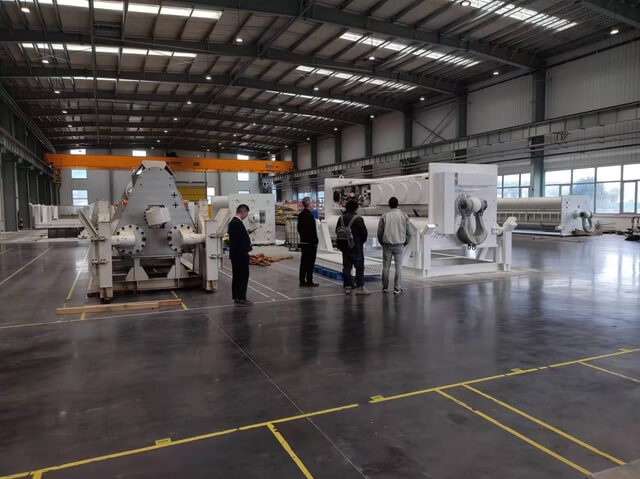 Four people inspecting Safelink products inside a warehouse